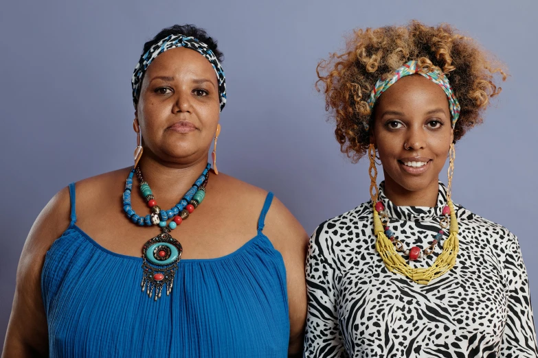 a couple of women standing next to each other, a portrait, by Ella Guru, black jewelry, avatar image, plus size, ethiopian