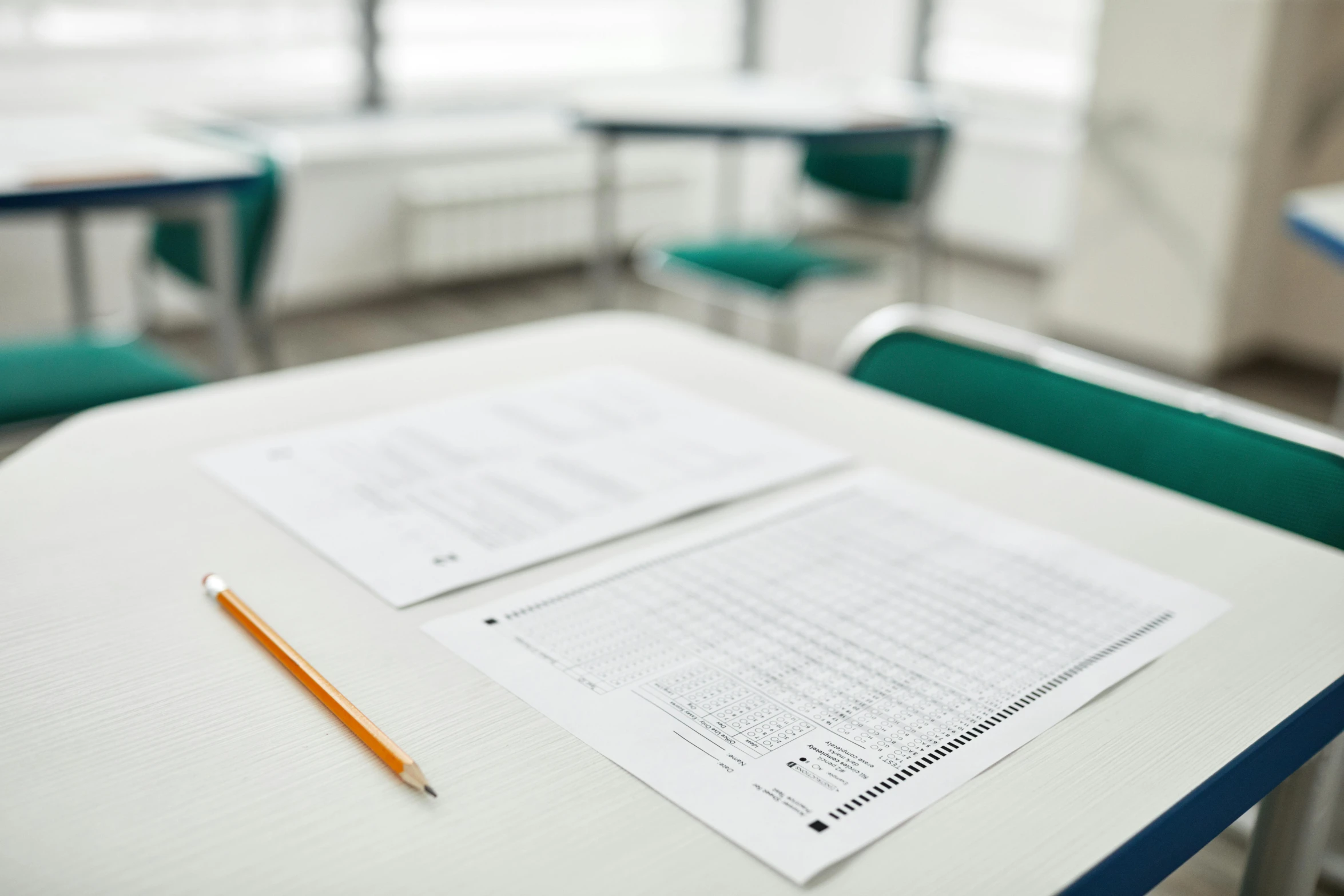 a desk with a pencil sitting on top of it, on a table, school curriculum expert, nursing, in rows