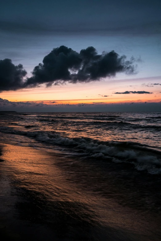 the sun is setting over the ocean on the beach, by Jan Tengnagel, unsplash contest winner, romanticism, brooding clouds', today\'s featured photograph 4k, humid evening, rippling