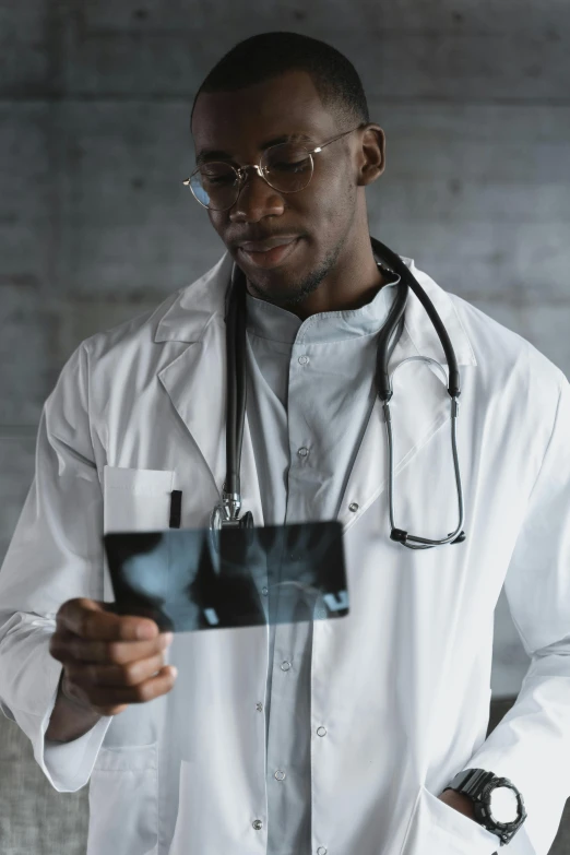 a man in a white lab coat holding an x - ray, a picture, pexels contest winner, black man, 15081959 21121991 01012000 4k, instagram post, black human spine