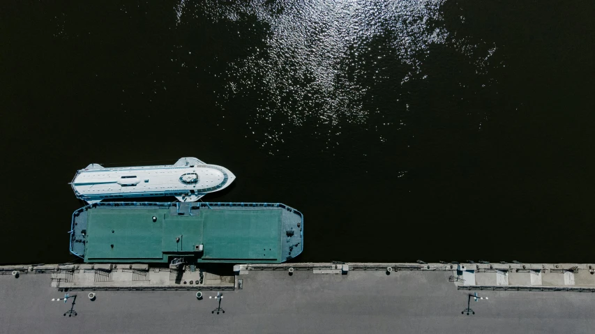 a boat floating on top of a body of water, by Jan Rustem, pexels contest winner, hurufiyya, industrial humanity spaceship, flat lay, near a jetty, thumbnail