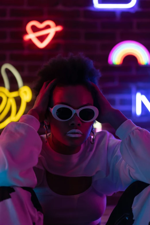 a woman standing in front of neon signs, trending on pexels, afrofuturism, digital sunglasses, bisexual lighting, white neon, vibrant: 0.75