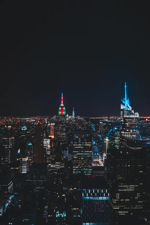 a view of a city at night from the top of a building, new york city skyline, high res 8k, instagram post, neon city