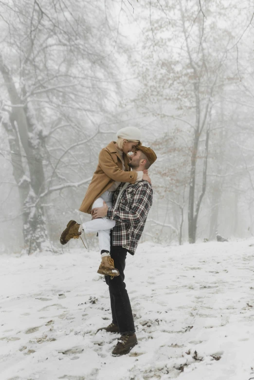 a man carrying a woman on his back in the snow, pexels contest winner, 🍁 cute, in a tree, mid body shot, gif