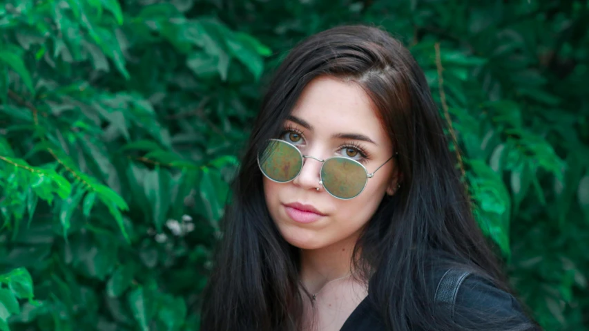 a woman with long black hair wearing sunglasses, inspired by Elsa Bleda, pexels contest winner, russian girlfriend, avatar image, green shades, wearing thin large round glasses