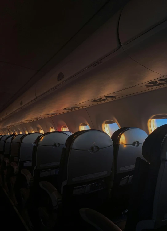 a row of empty seats in an airplane, an album cover, pexels contest winner, backlit glow, promo image, cabin lights, profile picture