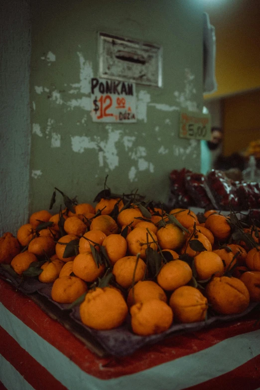 a pile of oranges sitting on top of a table, jakarta, lo-fi, square, inside a supermarket