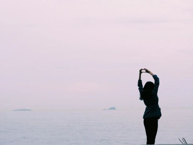 a woman standing in front of a body of water, pexels contest winner, romanticism, soft lilac skies, t pose, love in motion, minimalistic background