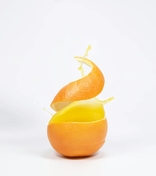 an orange with an orange peel sticking out of it, by Doug Ohlson, exploding, translucent eggs, behance lemanoosh, gen z