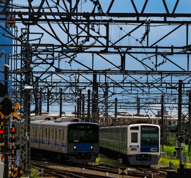 a couple of trains that are on some tracks, unsplash, sōsaku hanga, square, electricity archs, ad image, maintenance photo