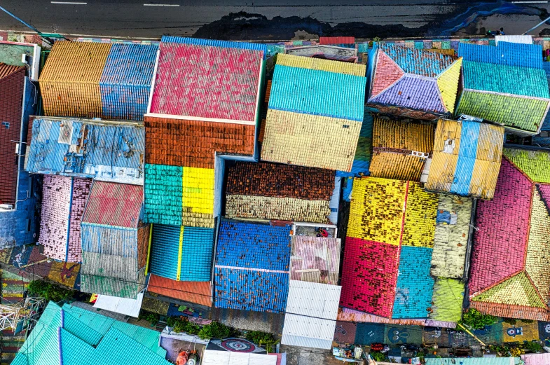 a bird's eye view of a bunch of colorful roofs, inspired by Steve McCurry, maximalism, manila, multicolor, flat