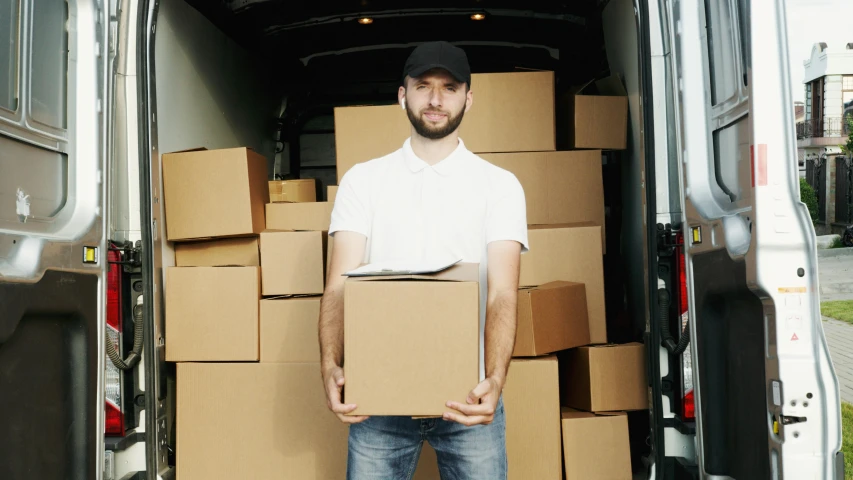 a man standing in the back of a van holding a box, shutterstock, square, portrait image, bl, a person standing in front of a