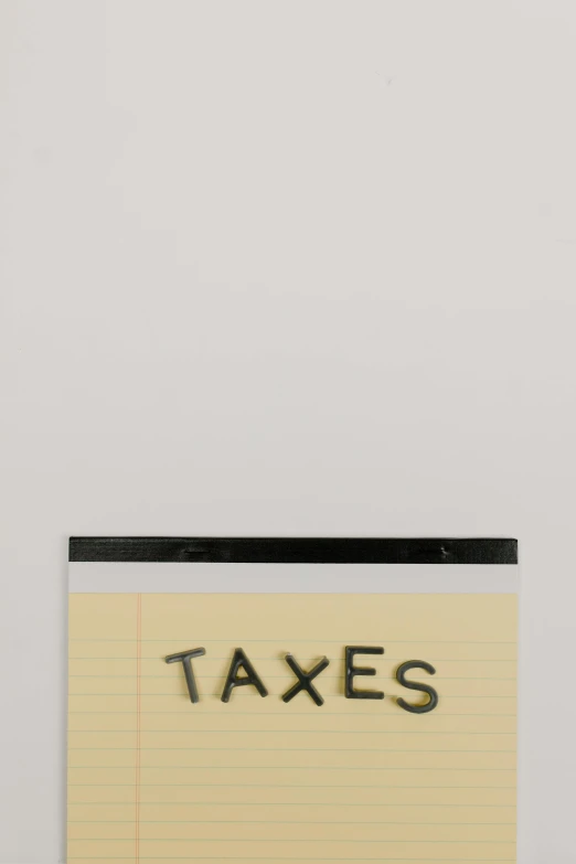 a piece of paper with the word taxes written on it, an album cover, by Awataguchi Takamitsu, conceptual art, ( ( dieter rams ) ), - 9, panel, taken on iphone 14 pro