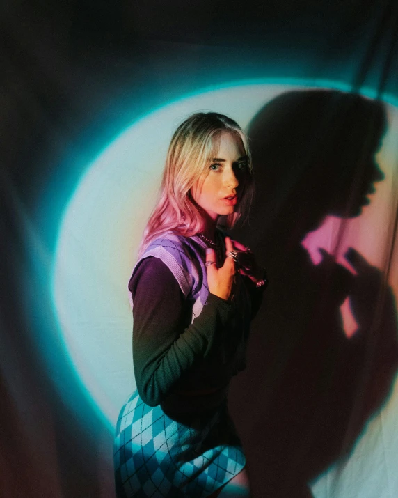 a woman that is standing in front of a wall, inspired by Elsa Bleda, trending on pexels, holography, saoirse ronan, portrait of harley quinn, shadow filled room with gloomy, “uwu the prismatic person