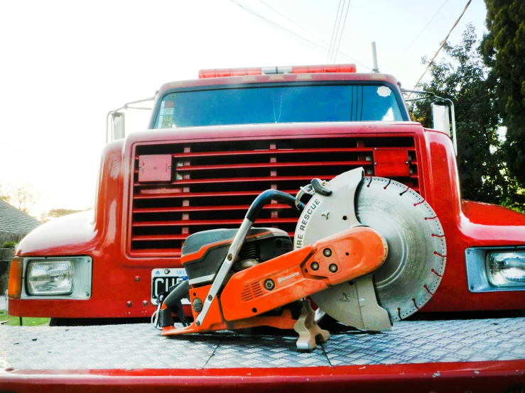 a red truck with a saw on the bed, pexels contest winner, firefighting gear, avatar image, construction equipment 1 9 9 0, instagram picture