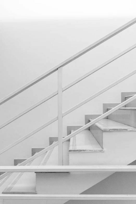 a black and white photo of a set of stairs, a minimalist painting, by Bauhaus, unsplash contest winner, white in color, square, railing, dream