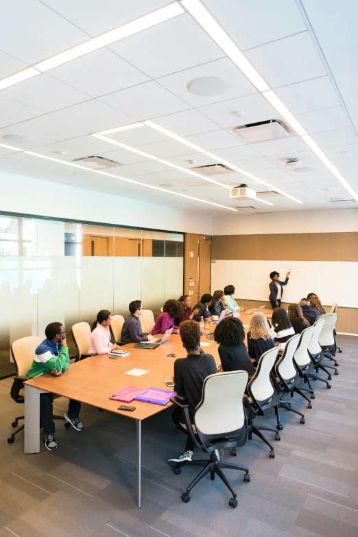 a group of people sitting around a conference table, by Arabella Rankin, pexels contest winner, office ceiling panels, panel of black, healthcare, 15081959 21121991 01012000 4k