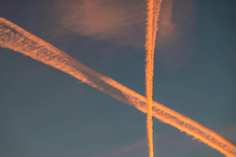 a couple of planes that are flying in the sky, by Attila Meszlenyi, pexels contest winner, auto-destructive art, neon cross, abstraction chemicals, beautiful late afternoon, cross hatched
