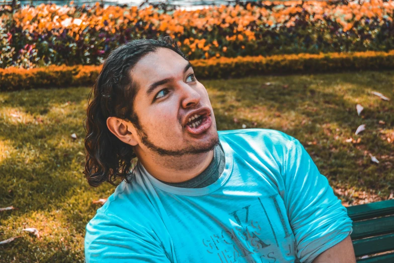 a man with long hair sitting on a bench, pexels contest winner, silly face, pokimane, avatar image, profile photo