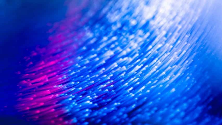 a close up of a cell phone with a blurry background, a microscopic photo, flickr, generative art, blue and violet color scheme, cable wires, optical fiber, abstract cloth simulation