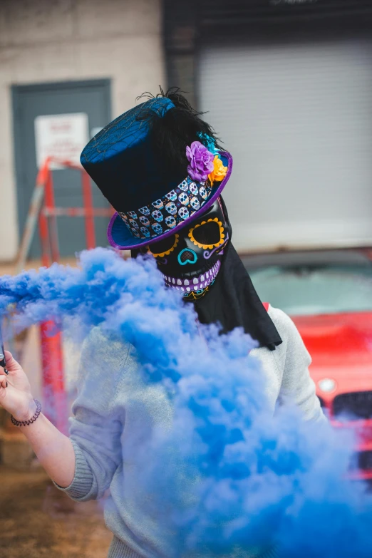 a woman with blue smoke coming out of her mouth, by Dan Content, pexels contest winner, street art, sugar skull, wearing a top hat, colorful smoke in the background, instagram post