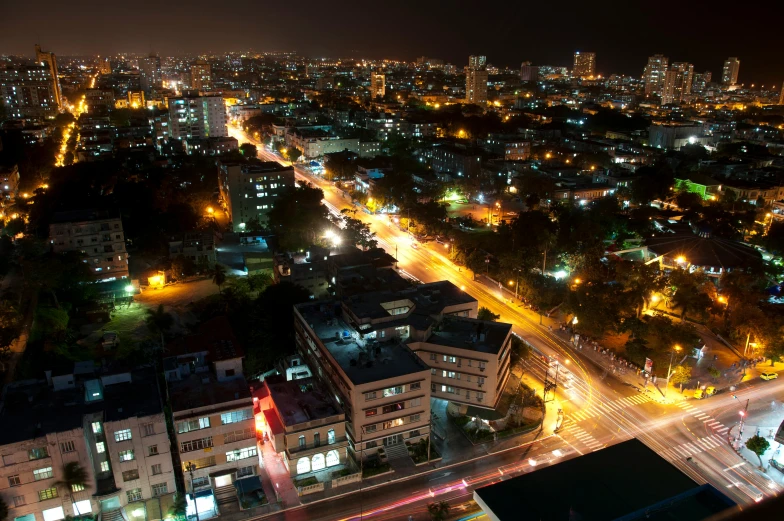 an aerial view of a city at night, by Alejandro Obregón, hurufiyya, colombo sri lankan city street, getty images, cuba, ultrawide lens”