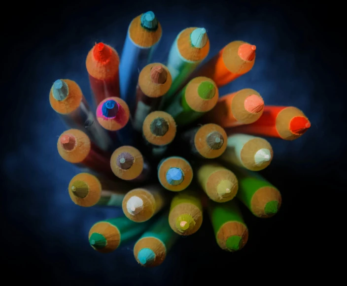 a close up of a bunch of colored pencils, by Doug Ohlson, pexels contest winner, crayon art, chartreuse and orange and cyan, portrait photo, midnight colors, top - down photograph