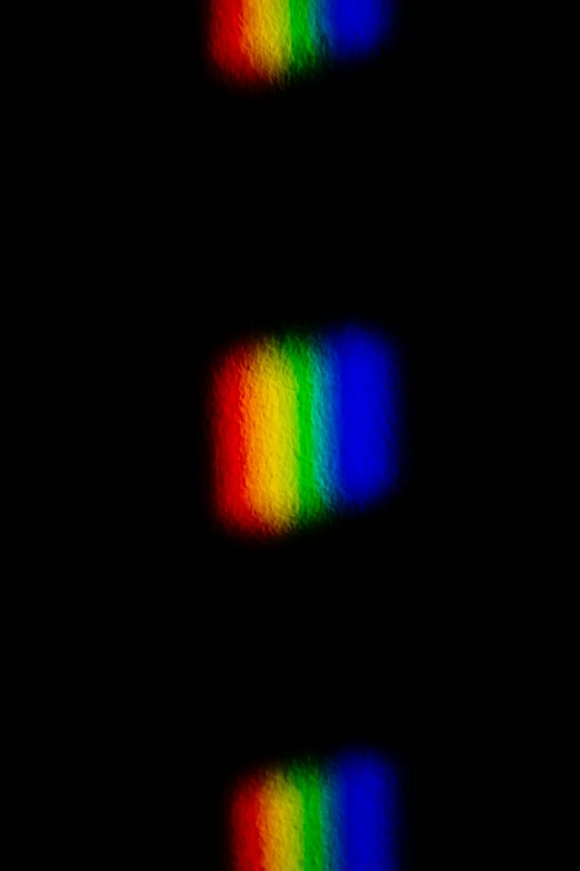 a close up of a rainbow colored light, a hologram, flickr, credit nasa, damaged webcam image, ( ( dithered ) ), taken in the late 2000s