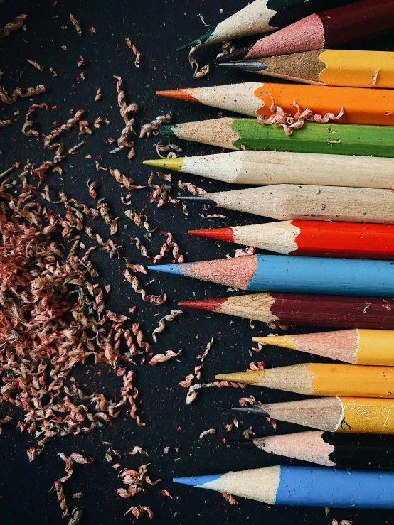 a pile of colored pencils next to a pile of shaving, pexels contest winner, crayon art, behance lemanoosh, black chalk, instagram story, 15081959 21121991 01012000 4k