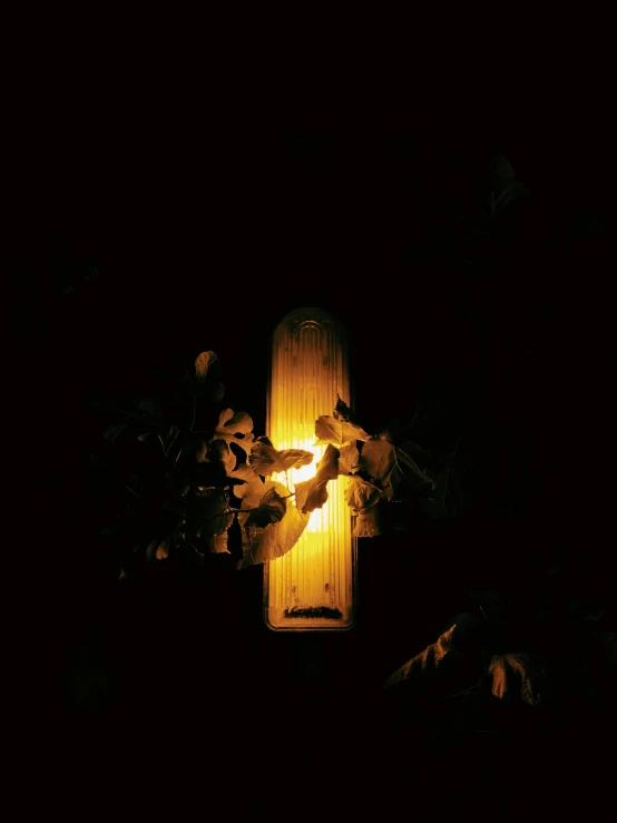 a cross that is lit up in the dark, an album cover, holding a lantern, harsh bloom lighting, taken in the 2000s, streetlight