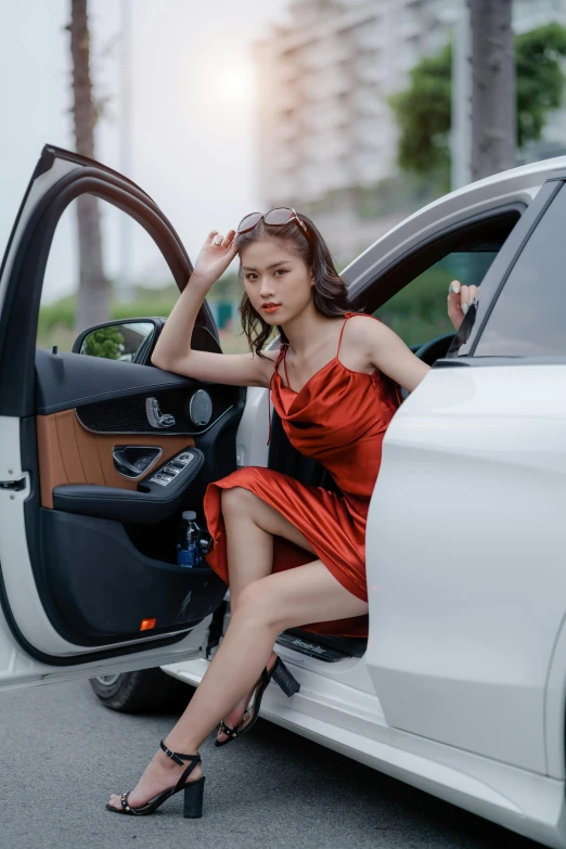 a woman in a red dress getting out of a white car, pexels contest winner, asian girl, square, leather interior, white and orange