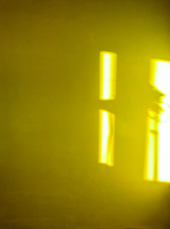 a bed sitting in a bedroom next to a window, a picture, inspired by Suzanne Duchamp-Crotti, unsplash, light and space, futuristic yellow lens, shadow of catholic church cross, experimental studio light, video still