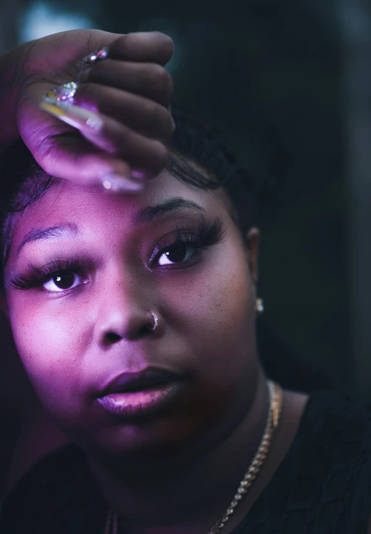 a close up of a person holding a cell phone, an album cover, soulful eyes, lizzo, dramatic soft shadow lighting, concerned expression