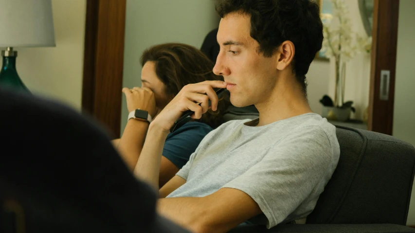 a man and a woman sitting on a couch, pexels contest winner, hyperrealism, sitting in the classroom, distant thoughtful look, young spanish man, close up to the screen