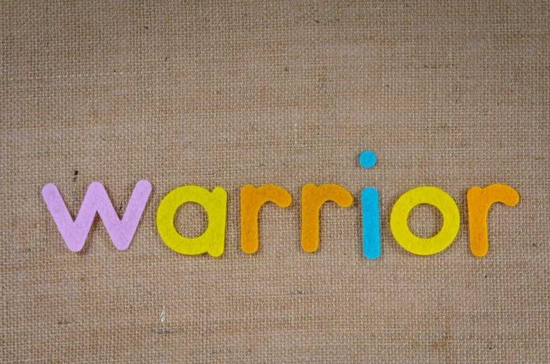 the word warrior written in colorful wooden letters, by Dorothea Warren O'Hara, trending on pixabay, made out of wool, on a yellow canva, human warrior, acronym
