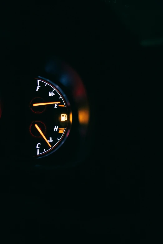 the dashboard of a car in the dark, unsplash, gasoline engine, clock iconography, dark. no text, unfocused