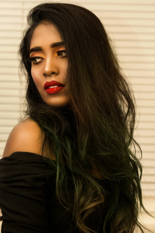 a close up of a woman with long hair, an album cover, by reyna rochin, trending on pexels, indian super model, green hair, light-red lips, black long curly hair