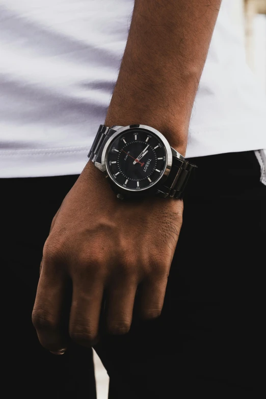 a close up of a person wearing a watch, inspired by Károly Lotz, black steel with red trim, silver gold red details, product introduction photo