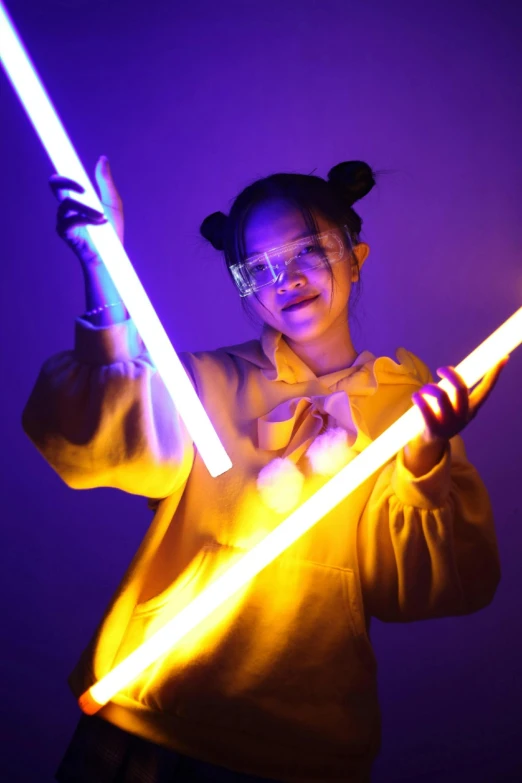 a woman holding a light saber in front of her face, inspired by Zhu Da, futuristic glasses lenses, yellow aura, bella poarch, holding a magic staff