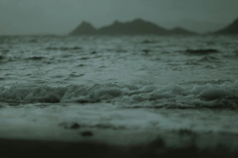 a black and white photo of a body of water, a picture, unsplash contest winner, romanticism, green sea, severe out of focus, vaporwave ocean, dark green water