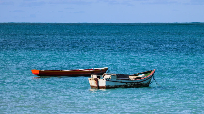 a couple of boats floating on top of a body of water, hurufiyya, madagascar, fan favorite, aruba, graphic print