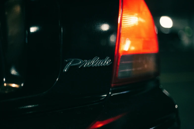 a close up of a car's tail light, pexels contest winner, photorealism, prelude to the esoteric, black car, instagram post, prairie