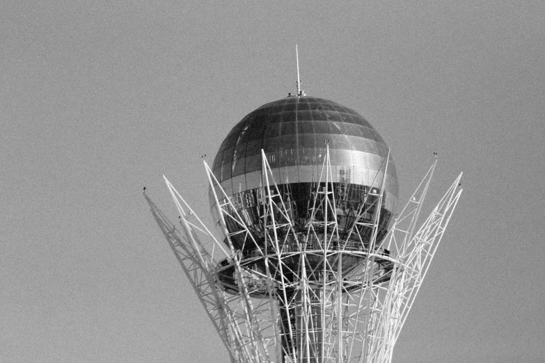 a black and white photo of a hot air balloon, by Andrei Kolkoutine, myllypuro water tower, glass and steel, dome of wonders, tehran