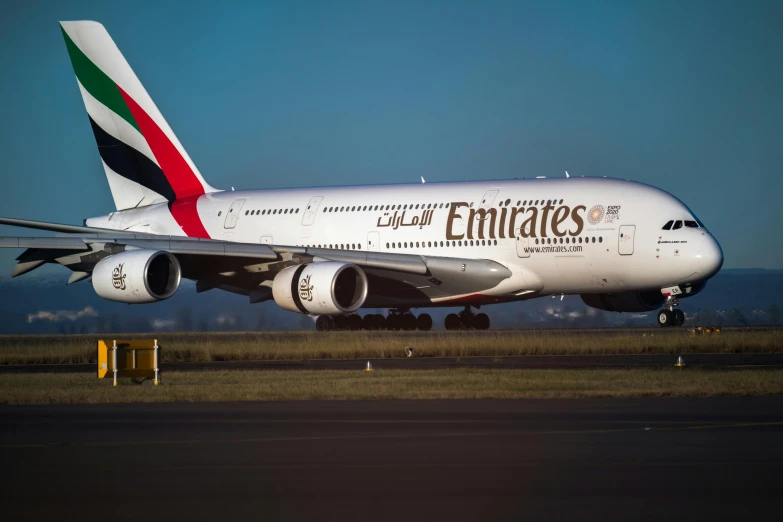 a large jetliner sitting on top of an airport runway, pexels contest winner, arabesque, sheikh mohammed ruler of dubai, high quality product image”, rectangle, australian