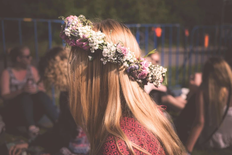 a woman with a flower crown on her head, pexels contest winner, over the shoulder view, girls, blond, vintage color