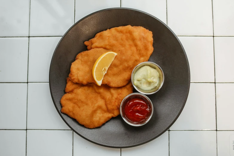 a plate that has some kind of food on it, battered, 3 - piece, nordic, soft skin