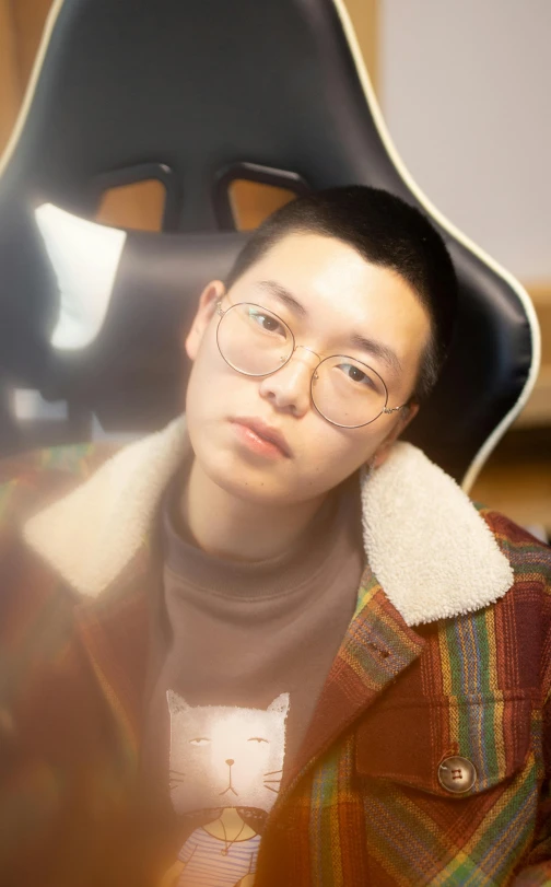 a close up of a person wearing a hat and glasses, a character portrait, inspired by Jang Seung-eop, reddit, sitting in chair, high-quality photo, young cute wan asian face, tang mo