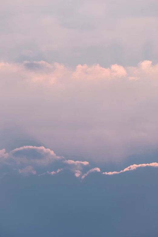 a large jetliner flying through a cloudy sky, unsplash, romanticism, soft light 4 k in pink, soft light - n 9, layered stratocumulus clouds, humid evening