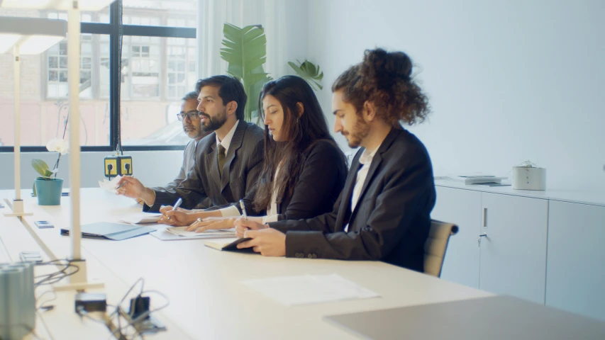 a group of people sitting around a table, profile image, opening shot, tv commercial, professional work