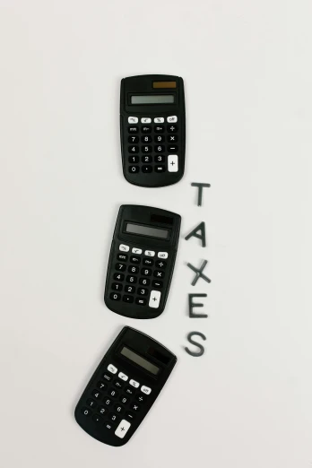 three calculators with the word taxes written on them, by Alejandro Obregón, pexels, sots art, portrait of tall, 64x64, high quality picture, smol